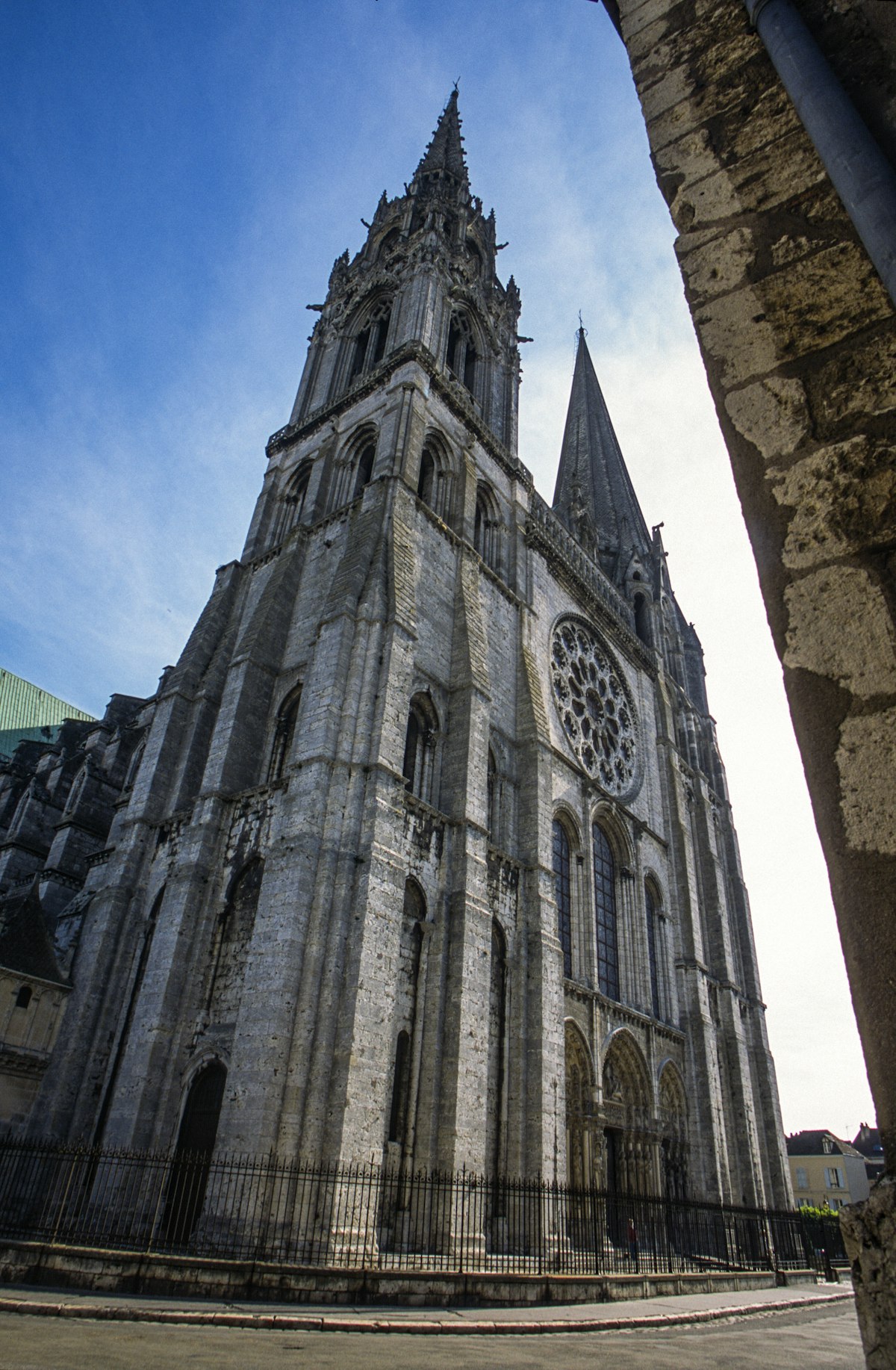 The west front of Chartres Cathedral with its two mismatched spires and rose window