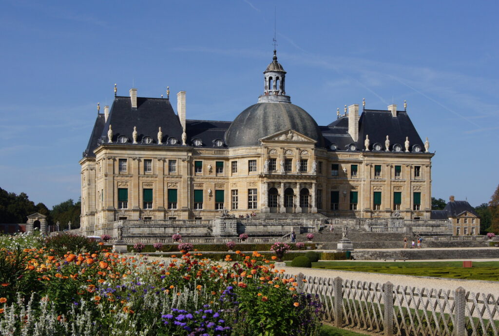 The garden facade of Vaux-le-Vicomte with its dome seen across the flower parterres